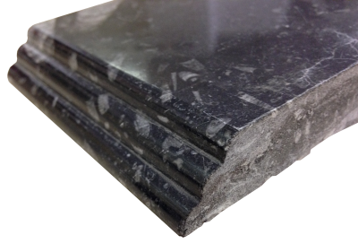 A cascade edge on fossil black marble. A cascade edge on fossil black marble.