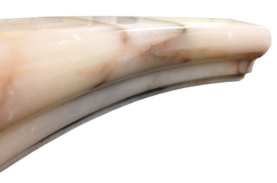 A custom edge on rose aurora marble. A custom edge on rose aurora marble.