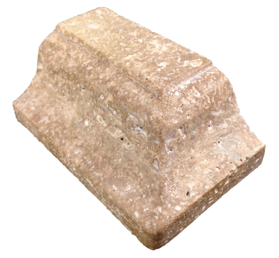 A custom edge on noche travertine. A custom edge on noche travertine.