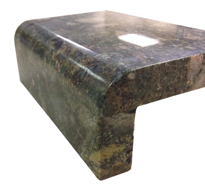 A laminated edge with a demi-bullnose and apron on verde marinace granite. A laminated edge with a demi-bullnose and apron on verde marinace granite.