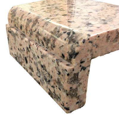 A laminated edge with a demi-bullnose and apron on rosa porrino granite. A laminated edge with a demi-bullnose and apron on rosa porrino granite.