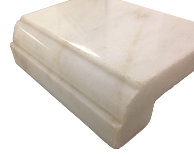 A laminated edge with a dupont and apron on calacatta oro marble. A laminated edge with a dupont and apron on calacatta oro marble.