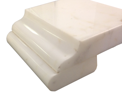 A laminated edge with an ogee and bullnose on calacatta oro marble. A laminated edge with an ogee and bullnose on calacatta oro marble.