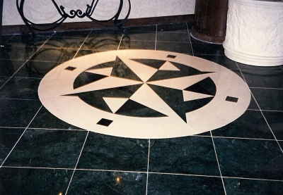 Inlaid logo made out of thassos marble. Inlaid logo made out of thassos marble.
