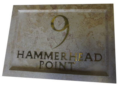 Inlaid sign made out of coralina limestone. Inlaid sign made out of coralina limestone.