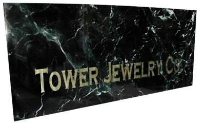 Inlaid sign made out of empress green marble. Inlaid sign made out of empress green marble.