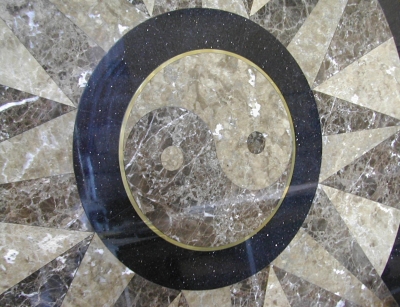 A custom inlay made out of light emperador, dark emperador, and galaxy black granites. A custom inlay made out of light emperador, dark emperador, and galaxy black granites.