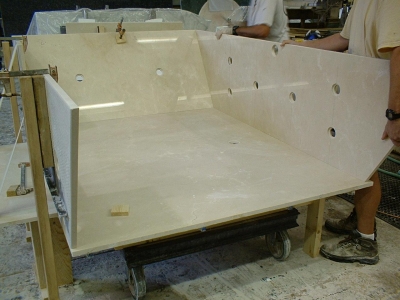 Constructing a custom crema marfil marble spa. Constructing a custom crema marfil marble spa.