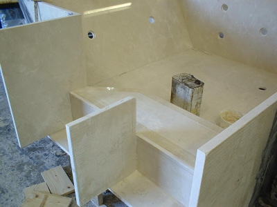 Constructing a custom crema marfil marble spa. Constructing a custom crema marfil marble spa.